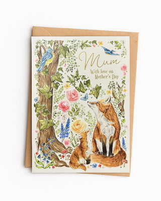 Greeting card with foxes, flowers, and 'Mum, with love on Mother's day' text on a white background