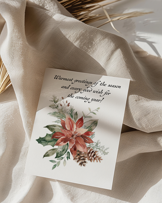 Christmas card with floral design and text on a beige fabric background